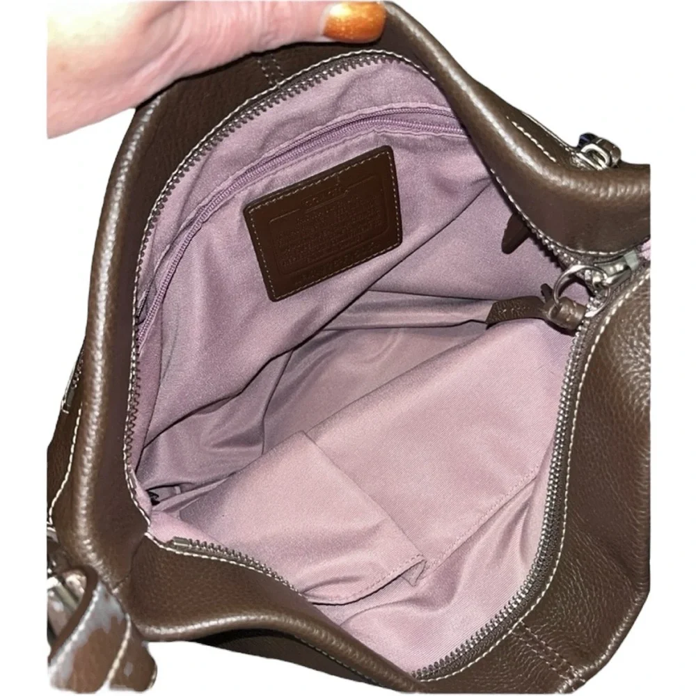 Coach brown leather hobo bag with light purple interior!